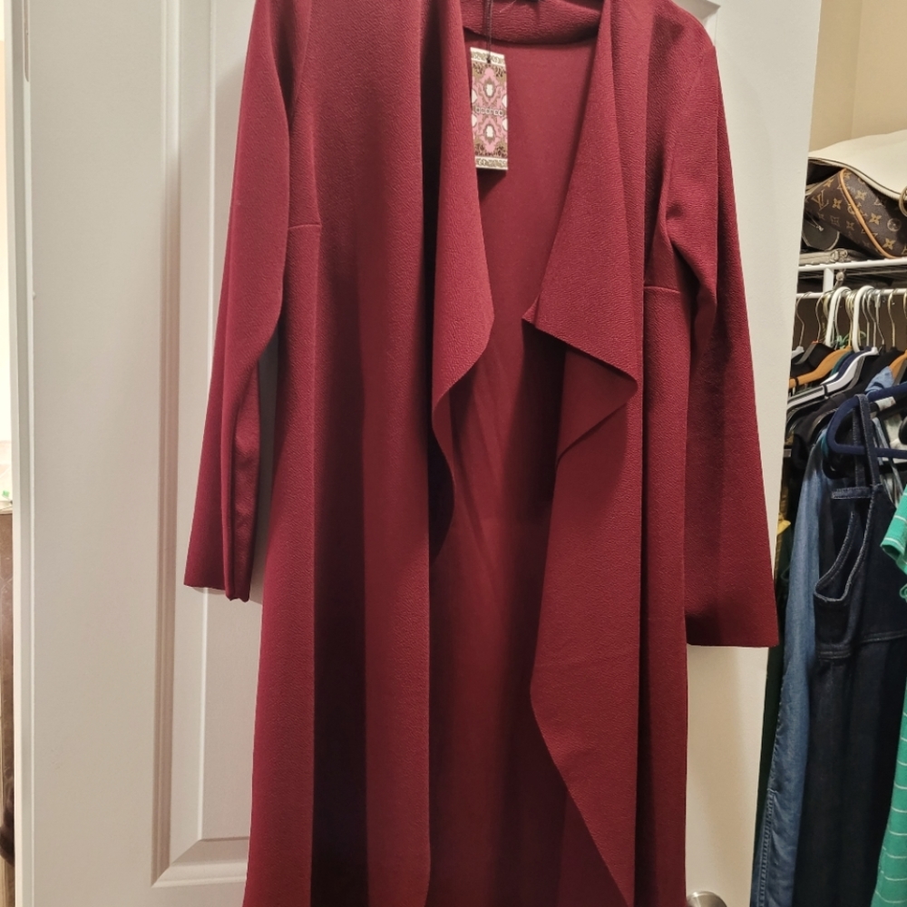 Never worn jacket  maroon color